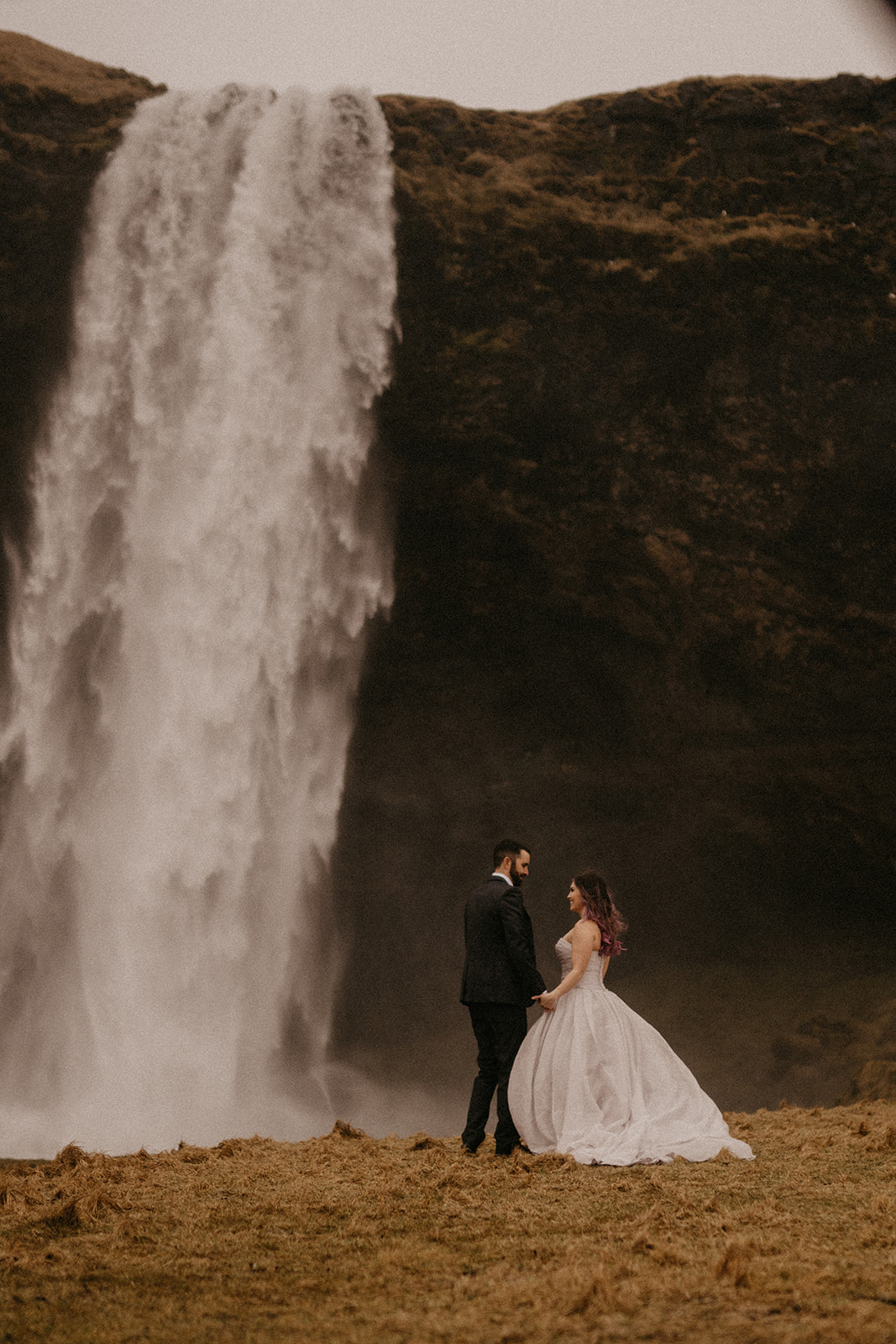 Elopement in Iceland: Love story at a waterfall. Experience the enchantment. #Elopement #Iceland #Waterfall #LoveStory