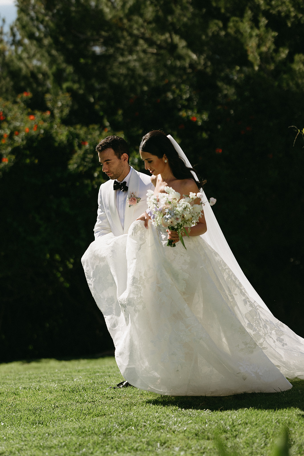 Newlyweds walking through venue on wedding day in Palos Verdes, California 