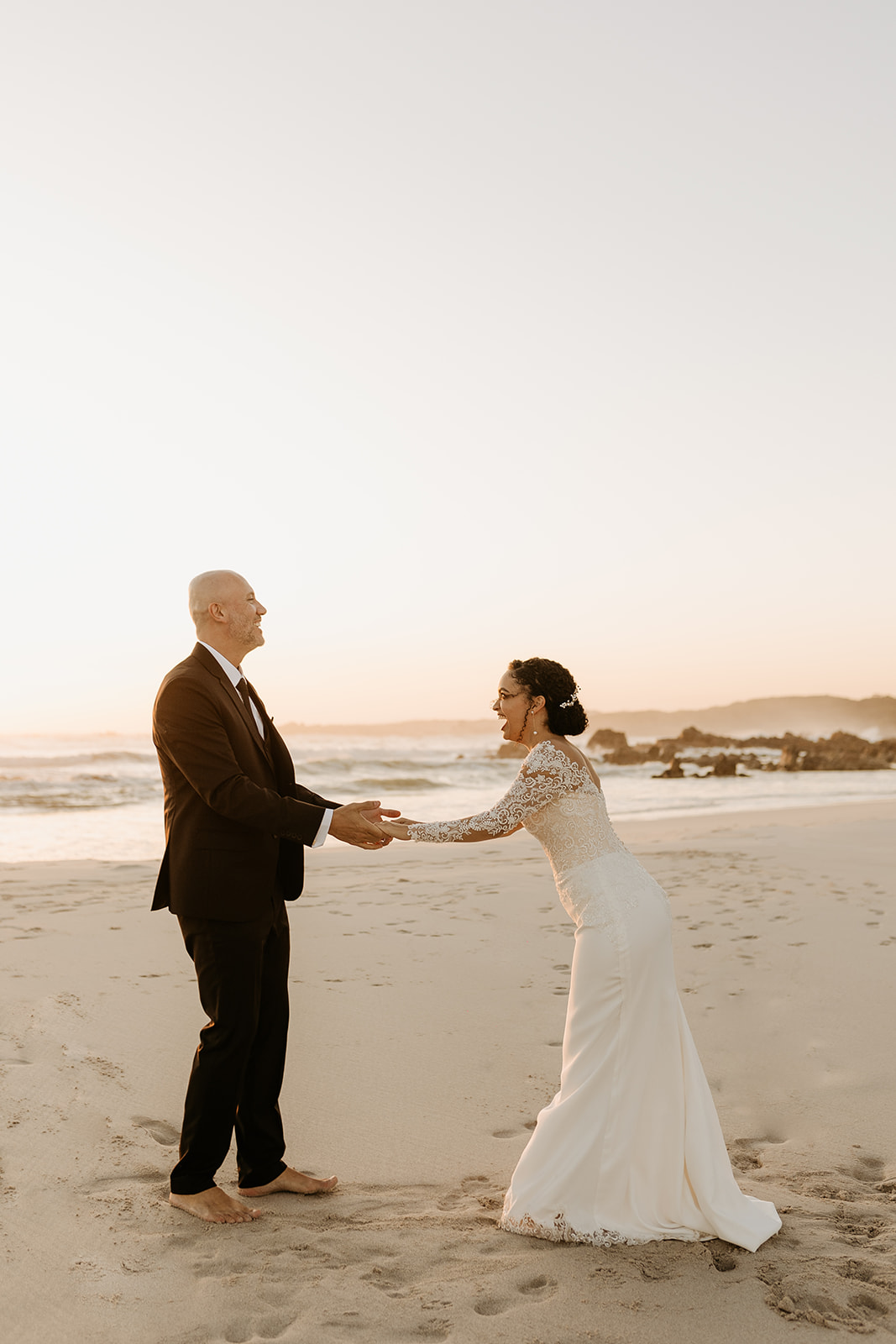 A couple who had an intimate wedding in Pringle Bay together on the beach at sunset