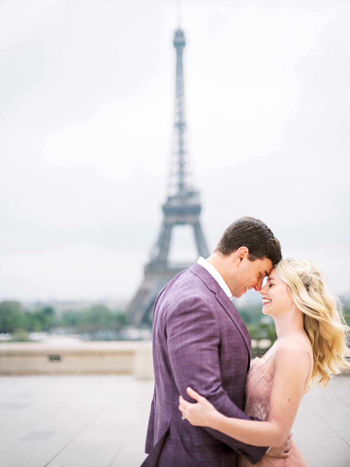 Couple with foreheads touching in Paris, France.