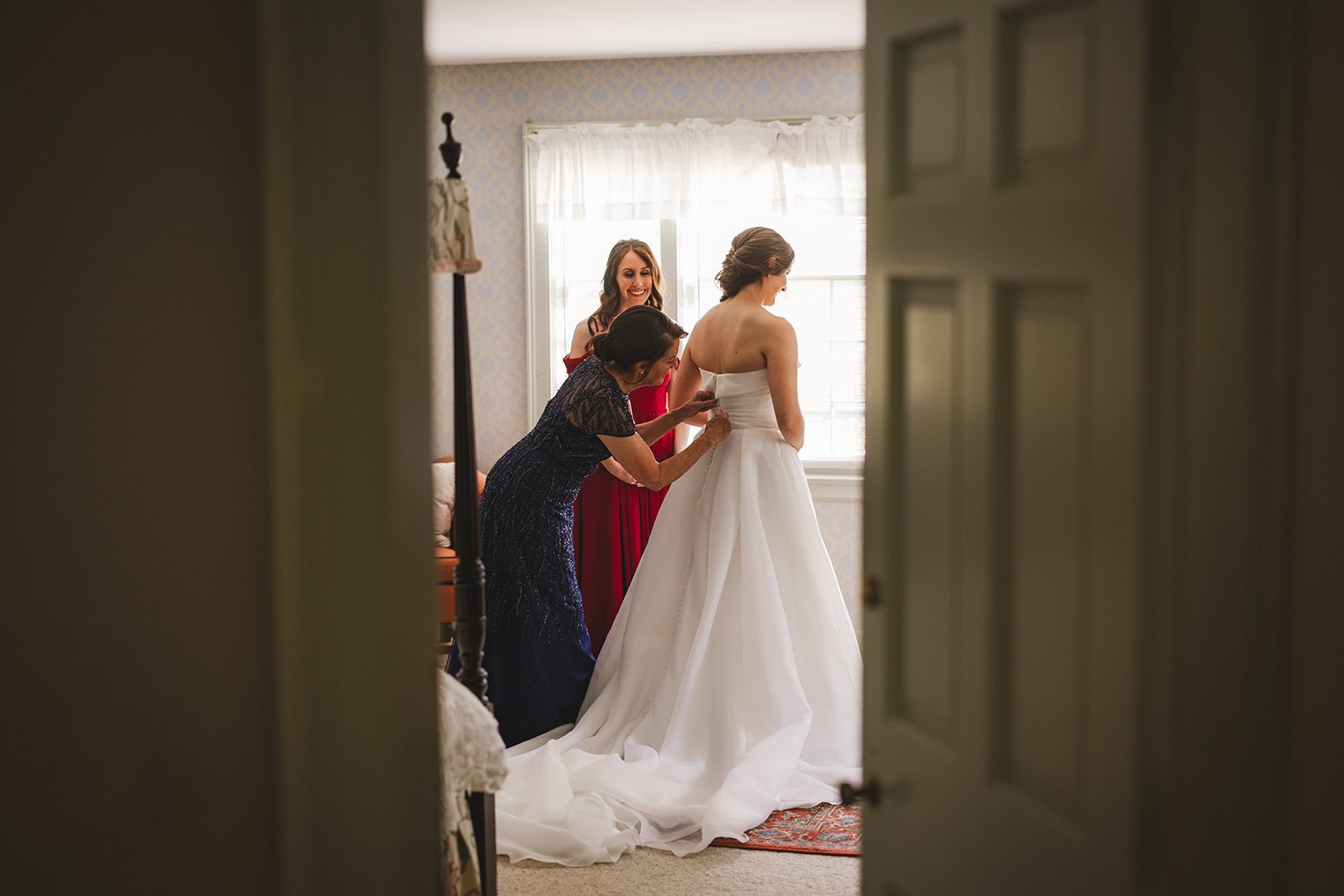 a bride gets ready for her wedding at the white gates house at the Grafton Inn