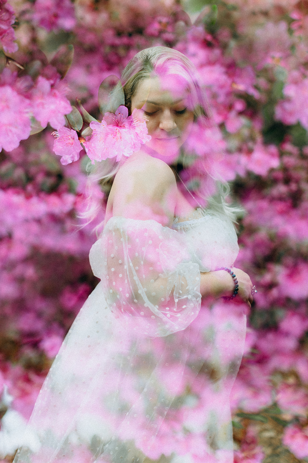 Artistic maternity image of a girl in white dress with pink flowers see through the image double exposure 