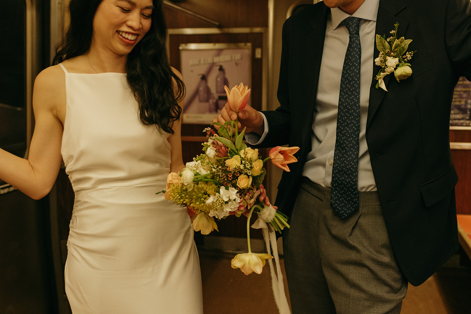 nyc bride and groom on the subway after elopement