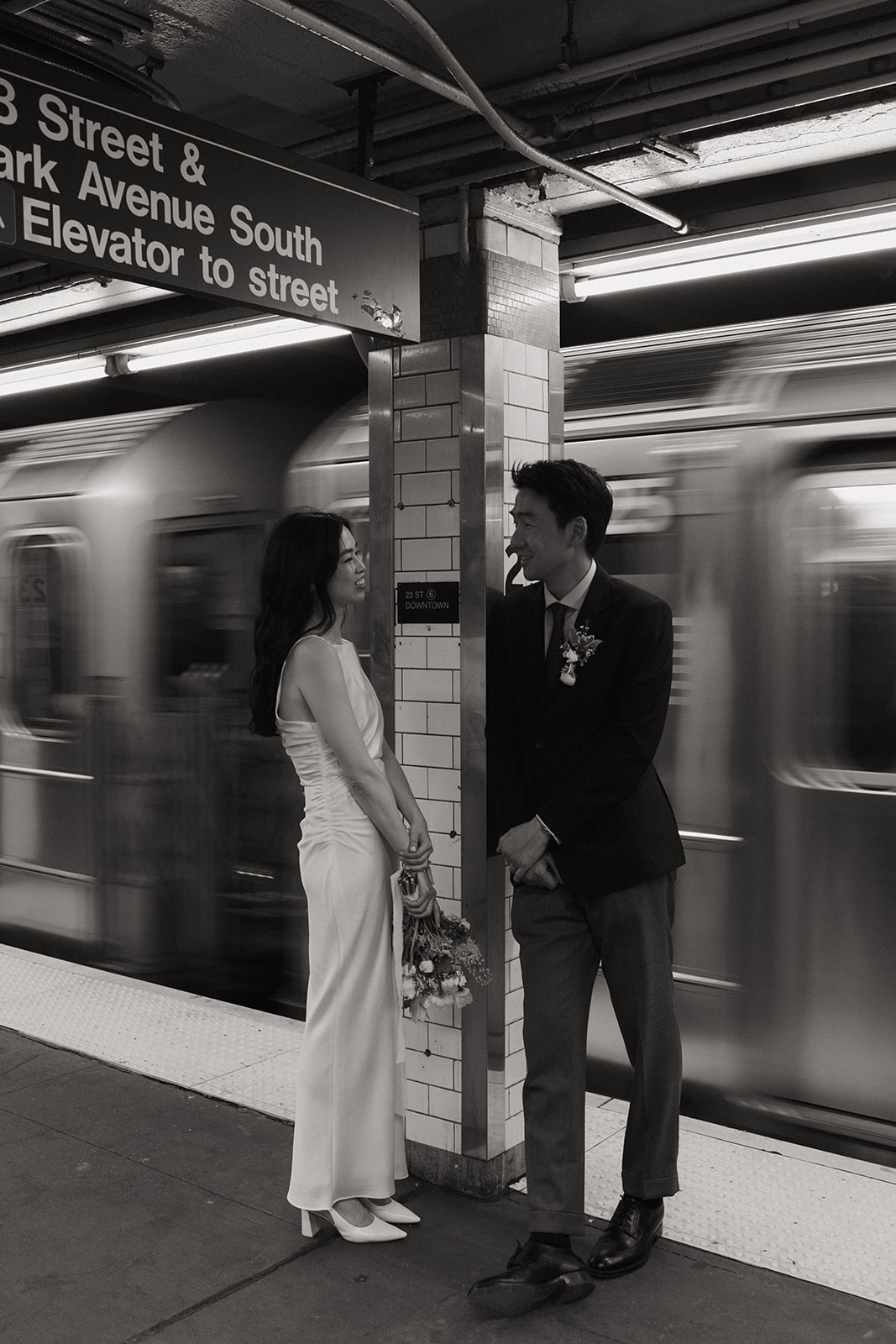 nyc bride and groom on the subway after elopement