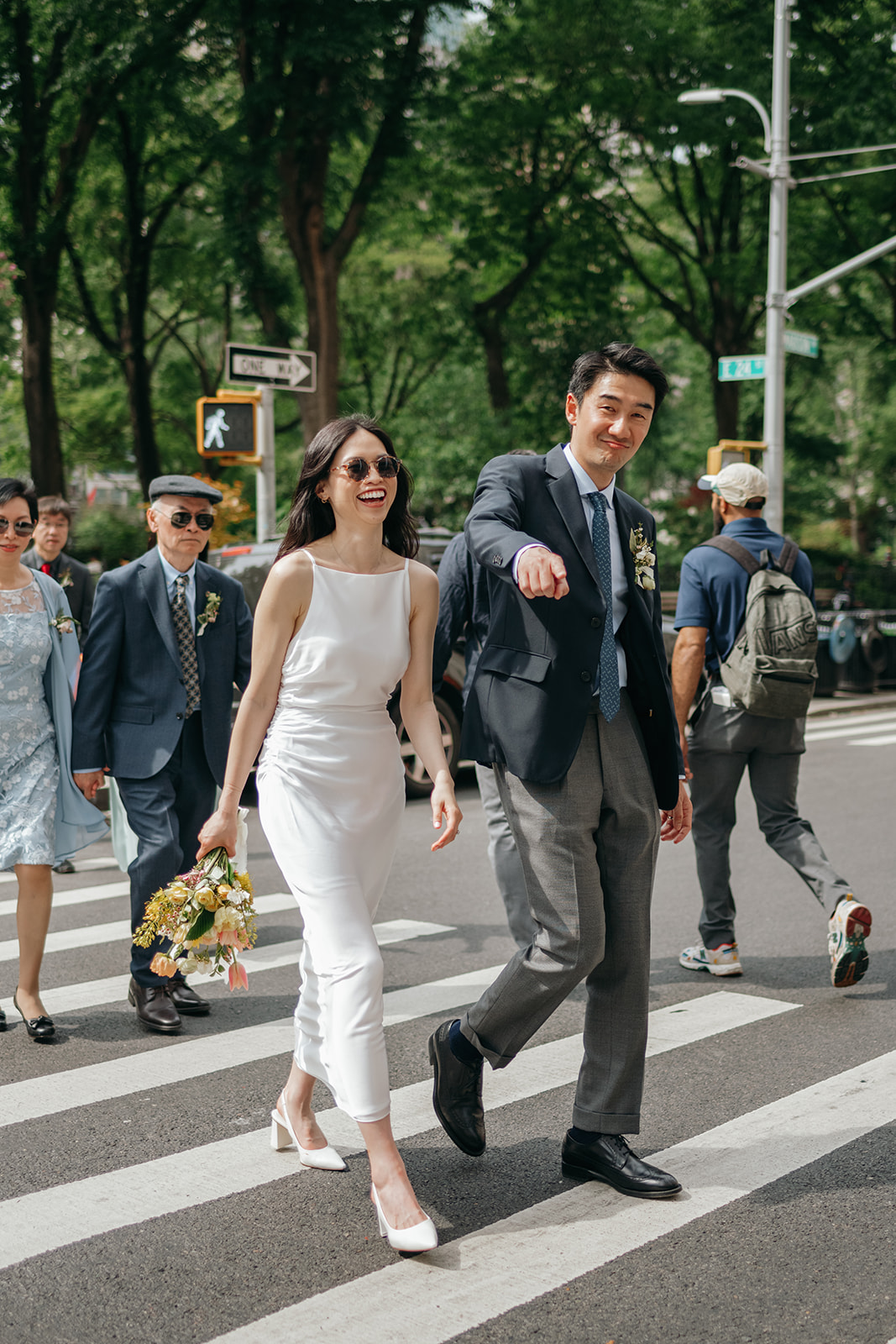 nyc couple walking across street after elopement