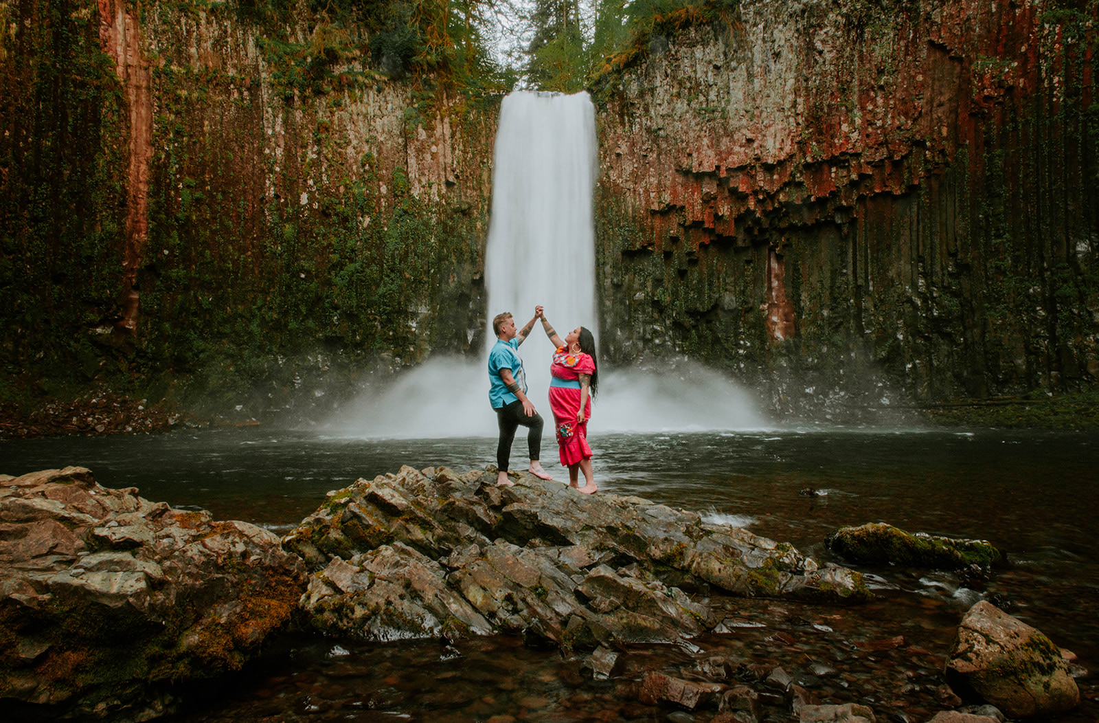 Couple dancing at Portland waterfall for their engagement photos. 
