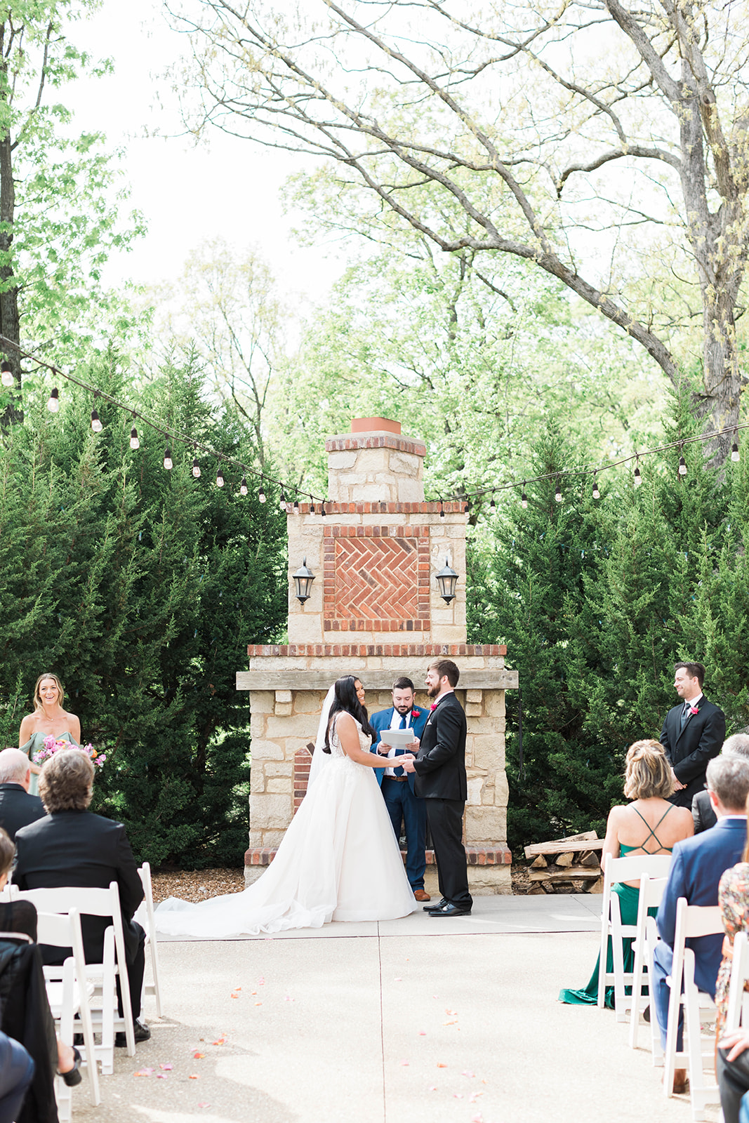 A spring wedding on the patio at Silver Oaks Chateau in front of the fireplace