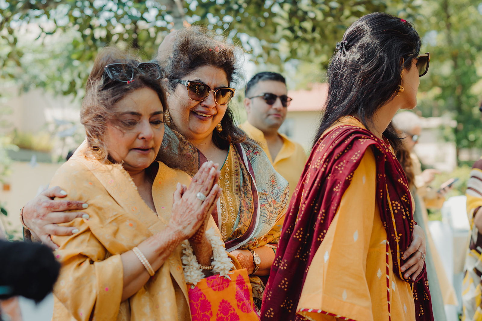 Emotional embrace: Mother moved to tears by the beauty of her daughter's haldi celebration.