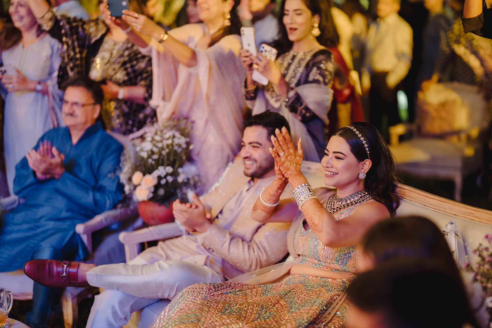 Dancing with love: Bride and groom relishing the festive atmosphere created by their guests