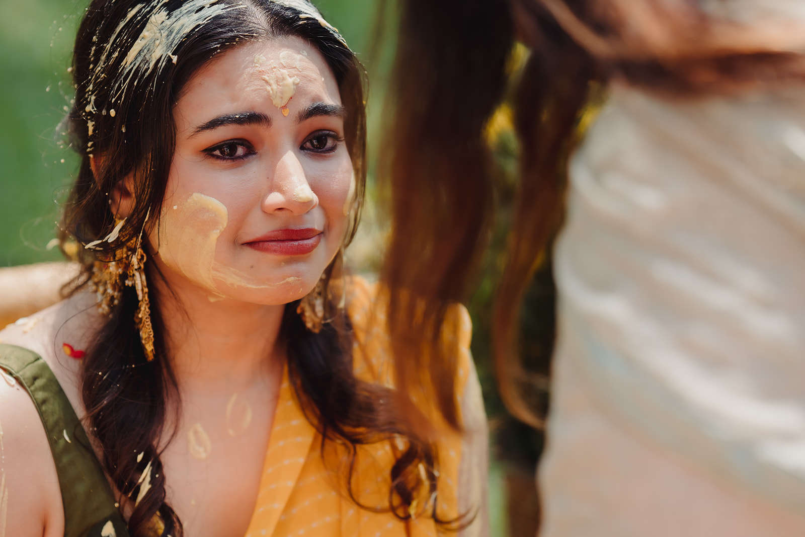 Heartfelt joy: Capturing the bride's emotional reaction in the midst of her haldi