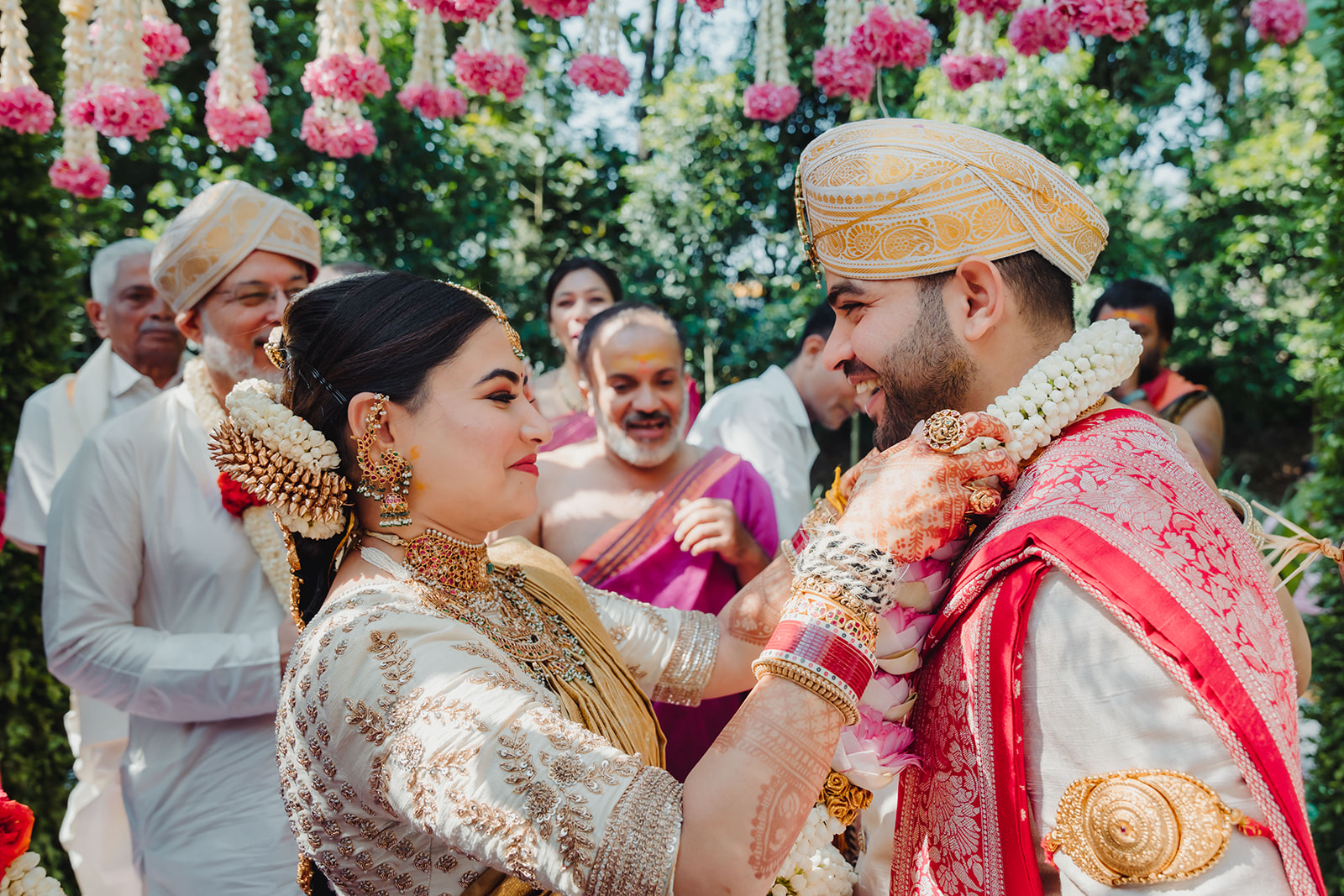 Ceremonial union: Capturing the symbolic exchange of garlands between the bride and groom.