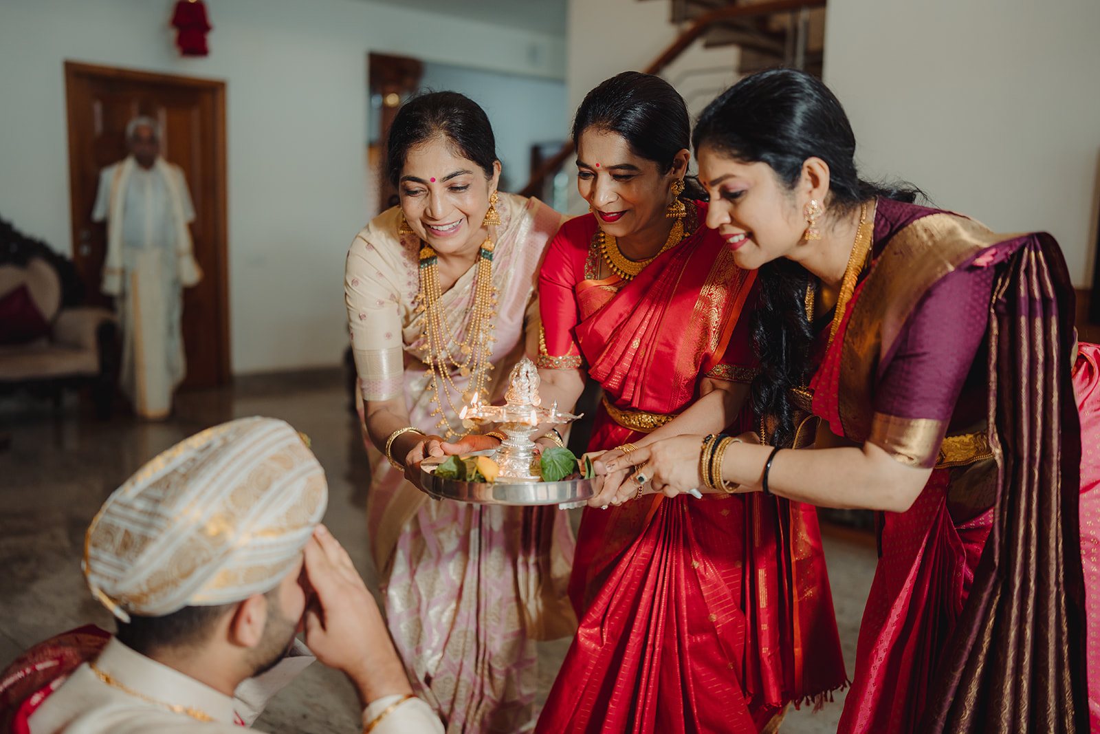 Blessings in light: Groom receives Arathi in a heartfelt and sacred ceremony from his family members
