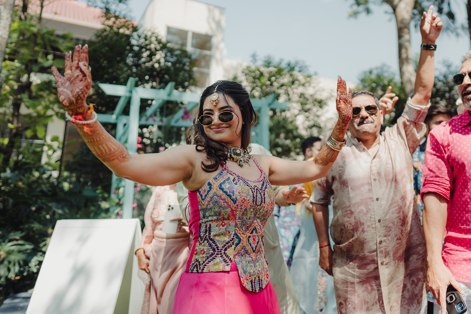 Dhol beats and dance: Bride creating a festive atmosphere with spirited movements
