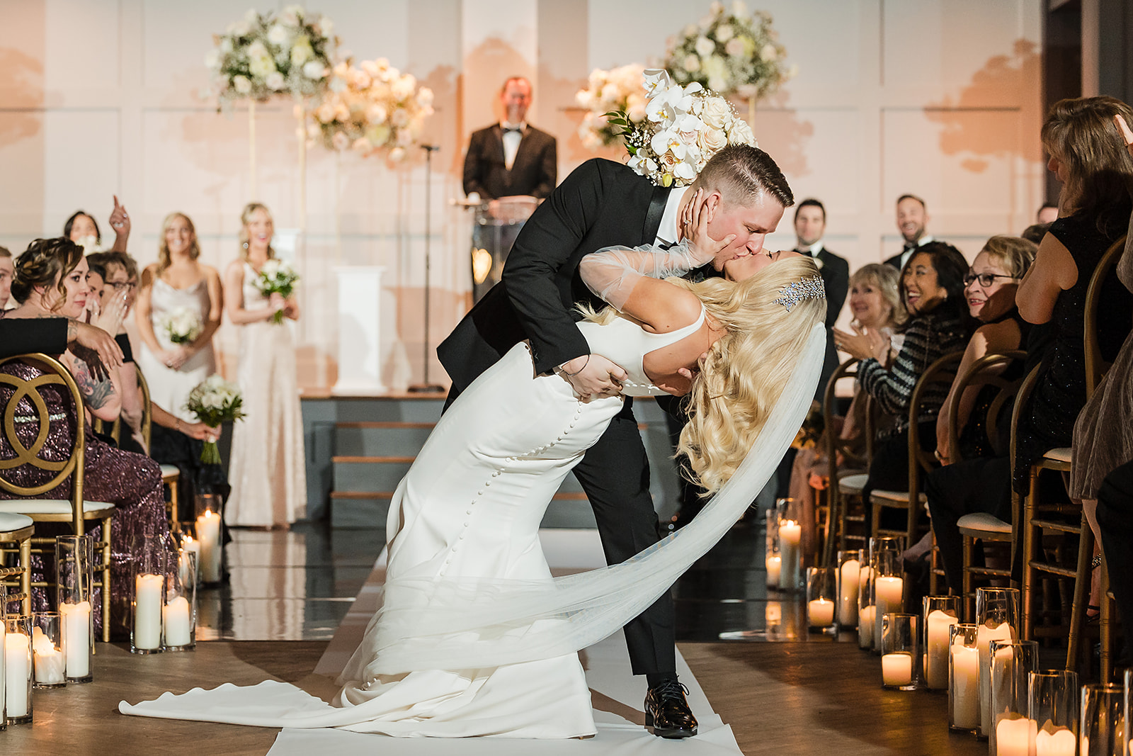 Bride and groom kiss down the aisle at The Lucy by Cescaphe in Philadelphia