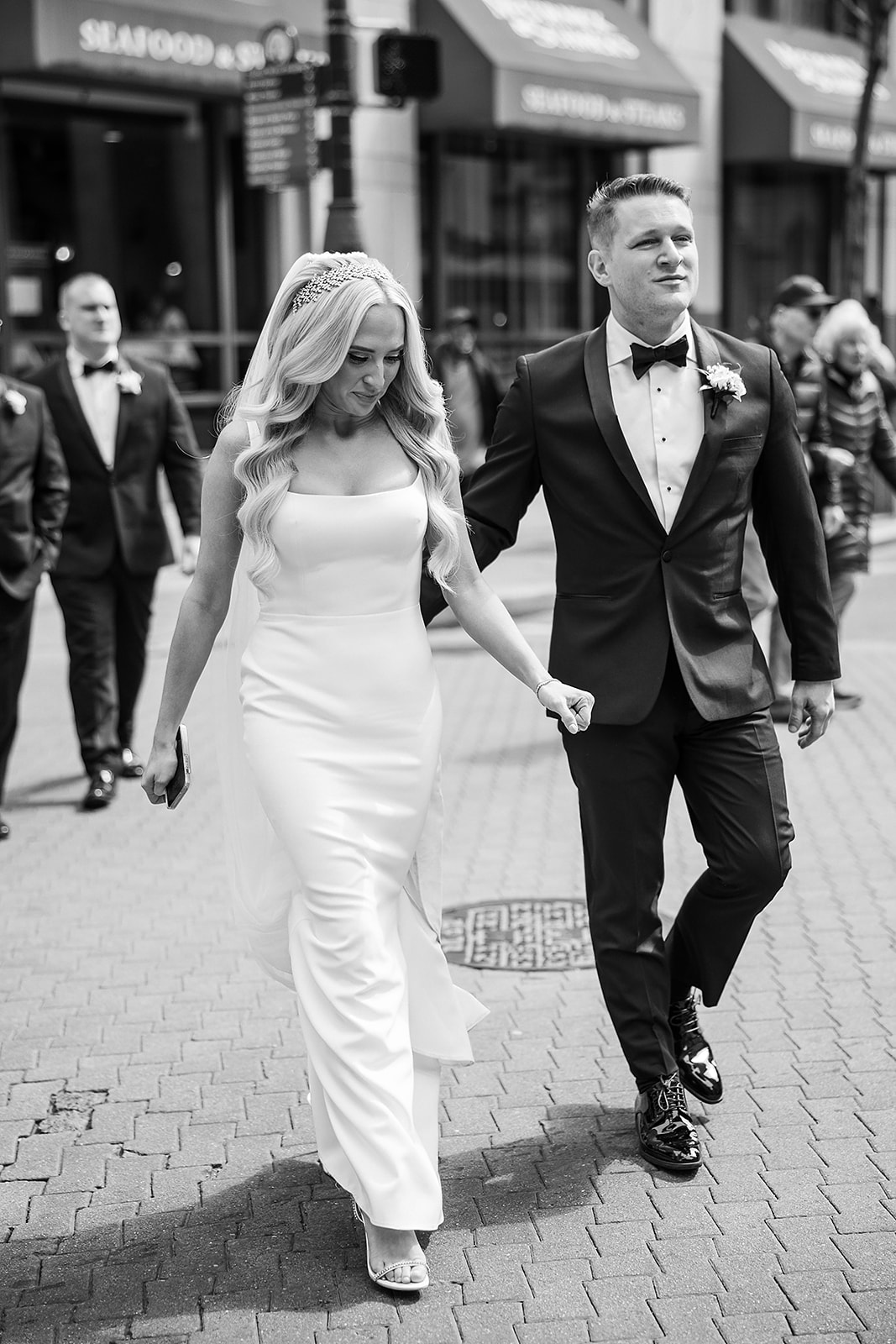 Candid black and white photo of the bride and groom on the street in the center city of Philadelphia