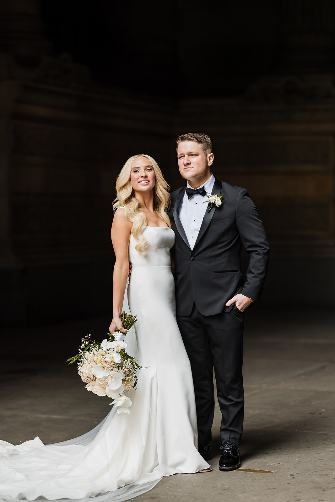 Dramatic wedding photo of the bride and groom at Philadephia City Hall