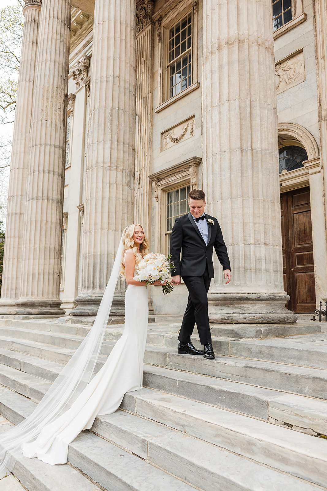 Stunning bride and groom on the steps of the First Bank in the Old City Philadelphia