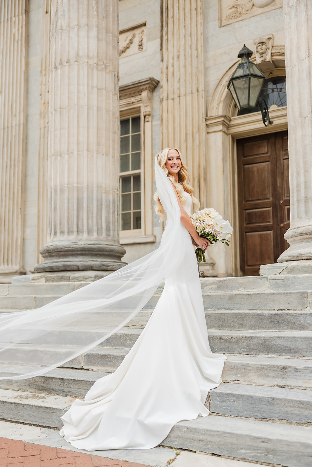 Stunning bride posing on the steps of the First Bank fo US in the Old City in Philly. 
