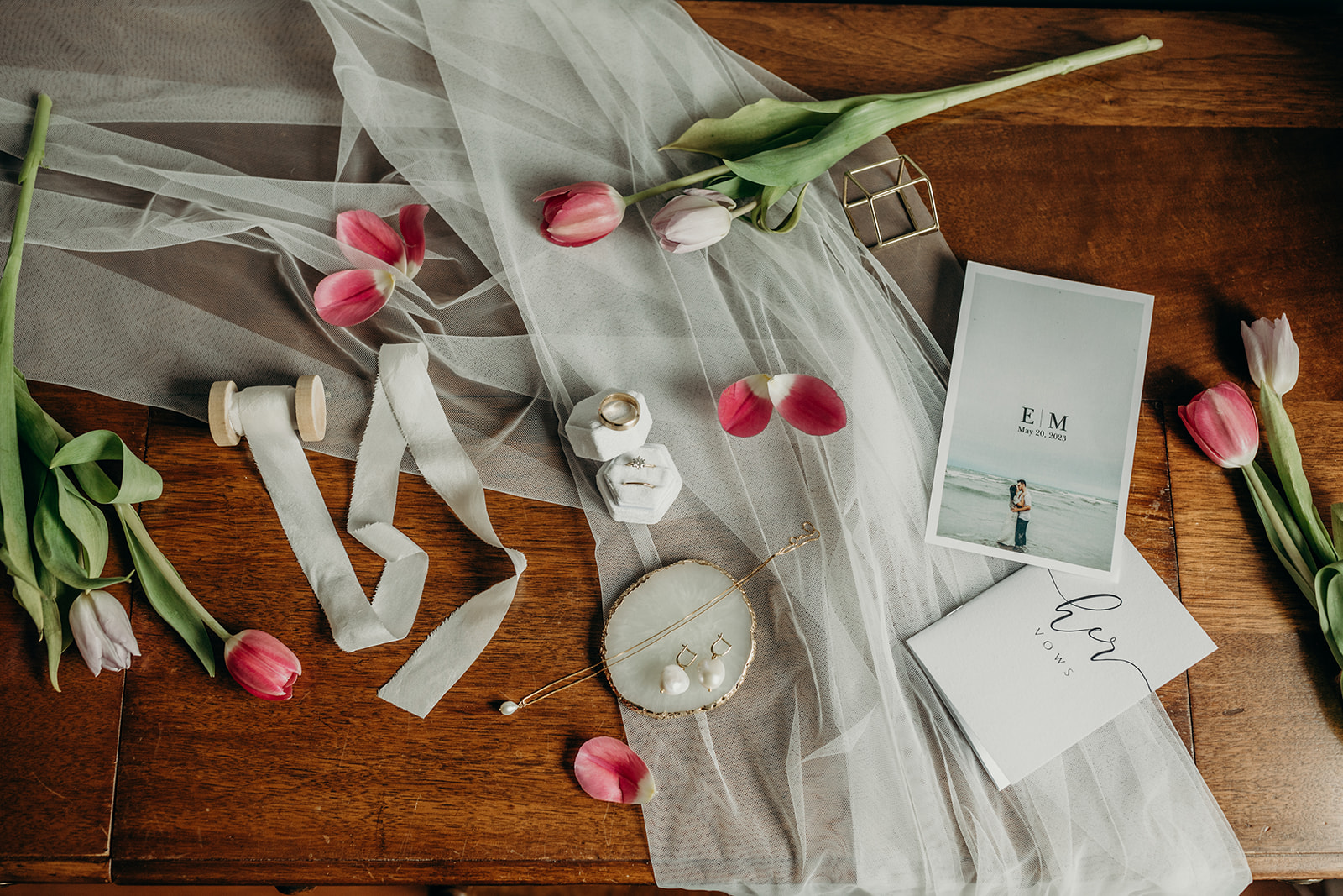 A flat lay photo of bridal details on during getting ready photos