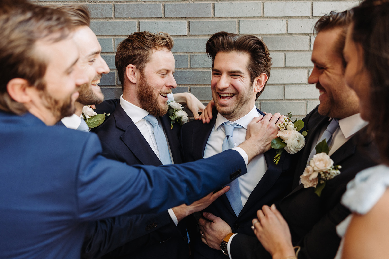 Wedding party celebrating with groom