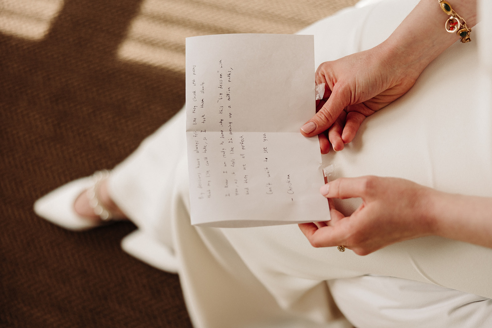 Bride reading a love letter in downtown Denver