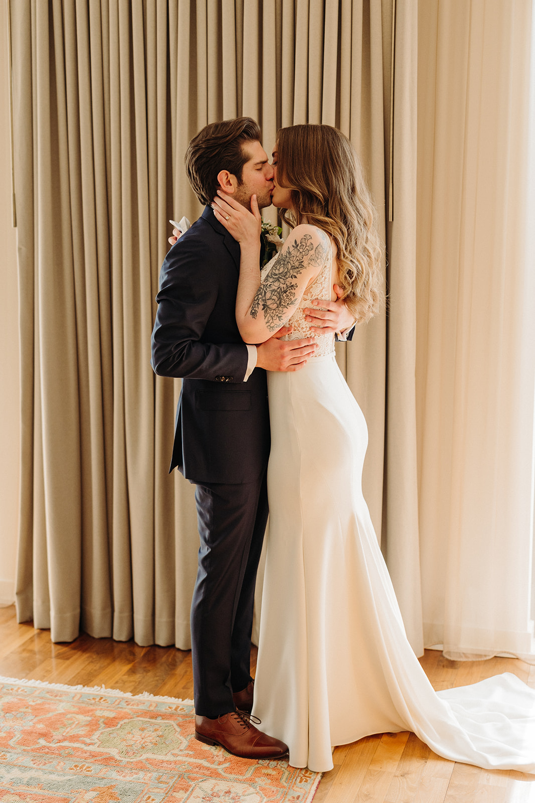Man and woman kissing during first look