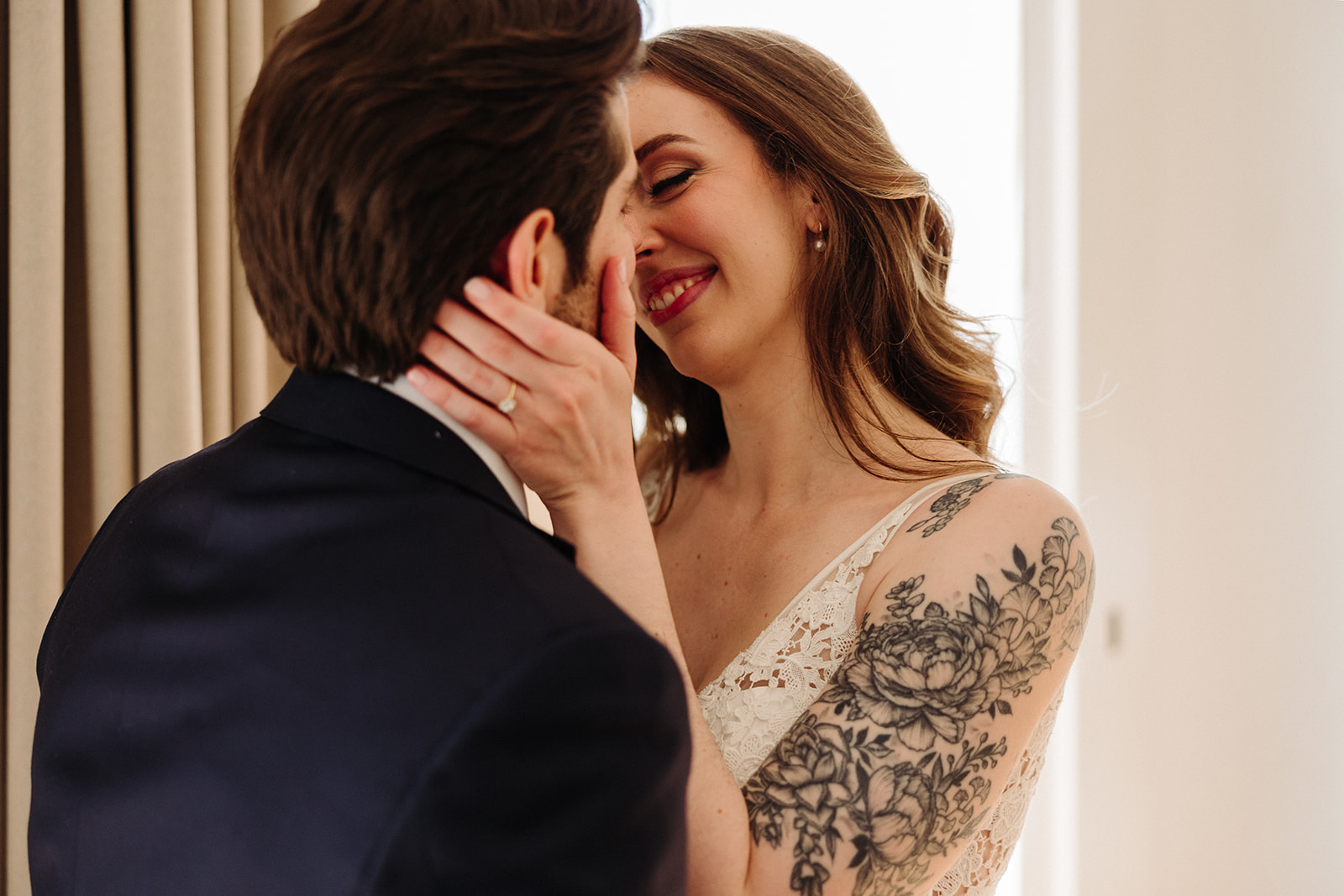 Bride and groom kissing during their first look