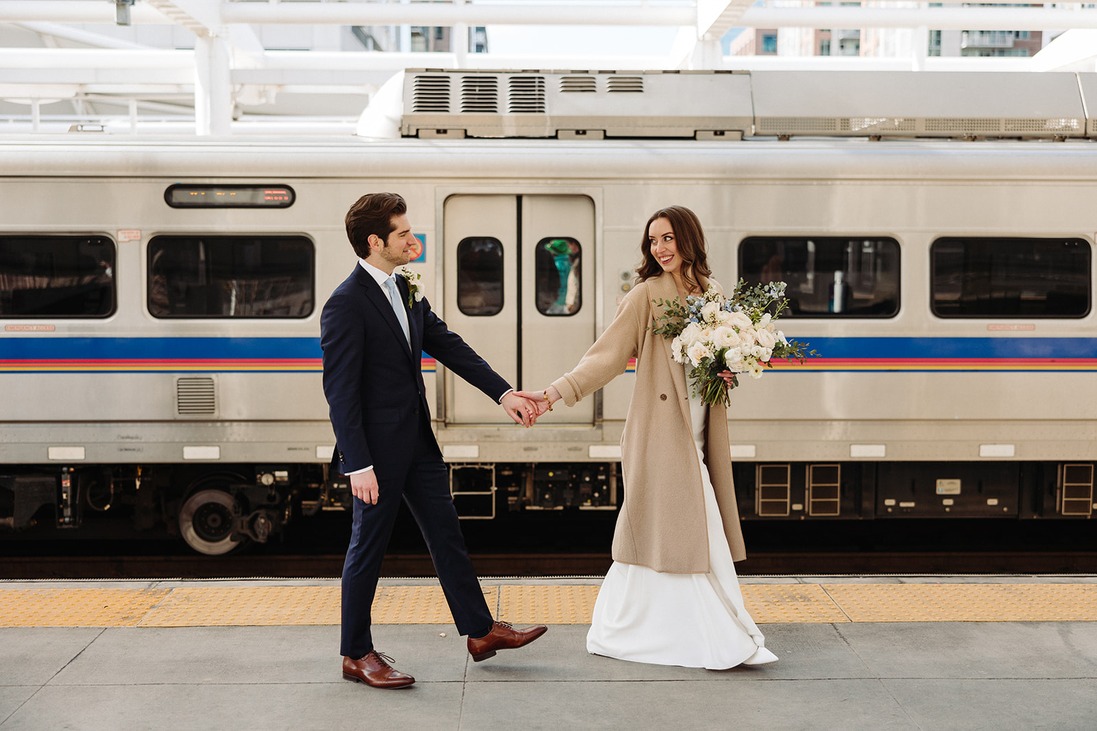 Bride and groom walking around union station