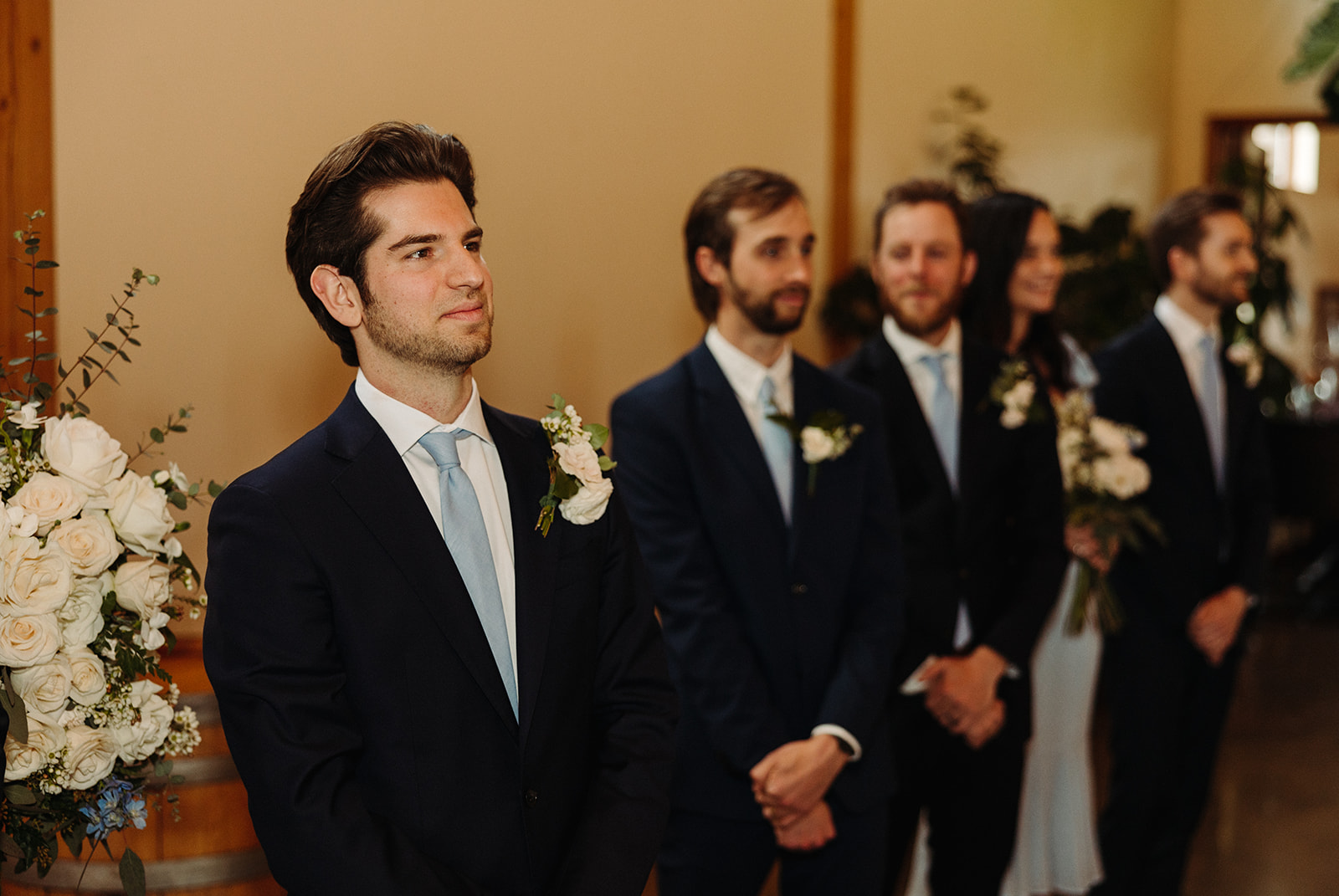 Groom and groomsmen standing at the altar