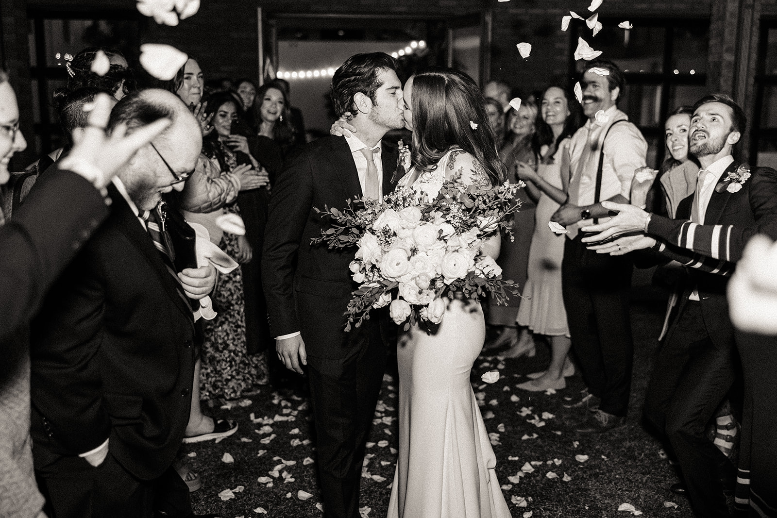 Bride and groom's send off with rose petals 