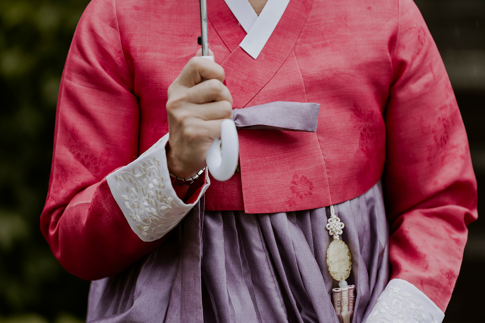 A woman in a pink hanbok.