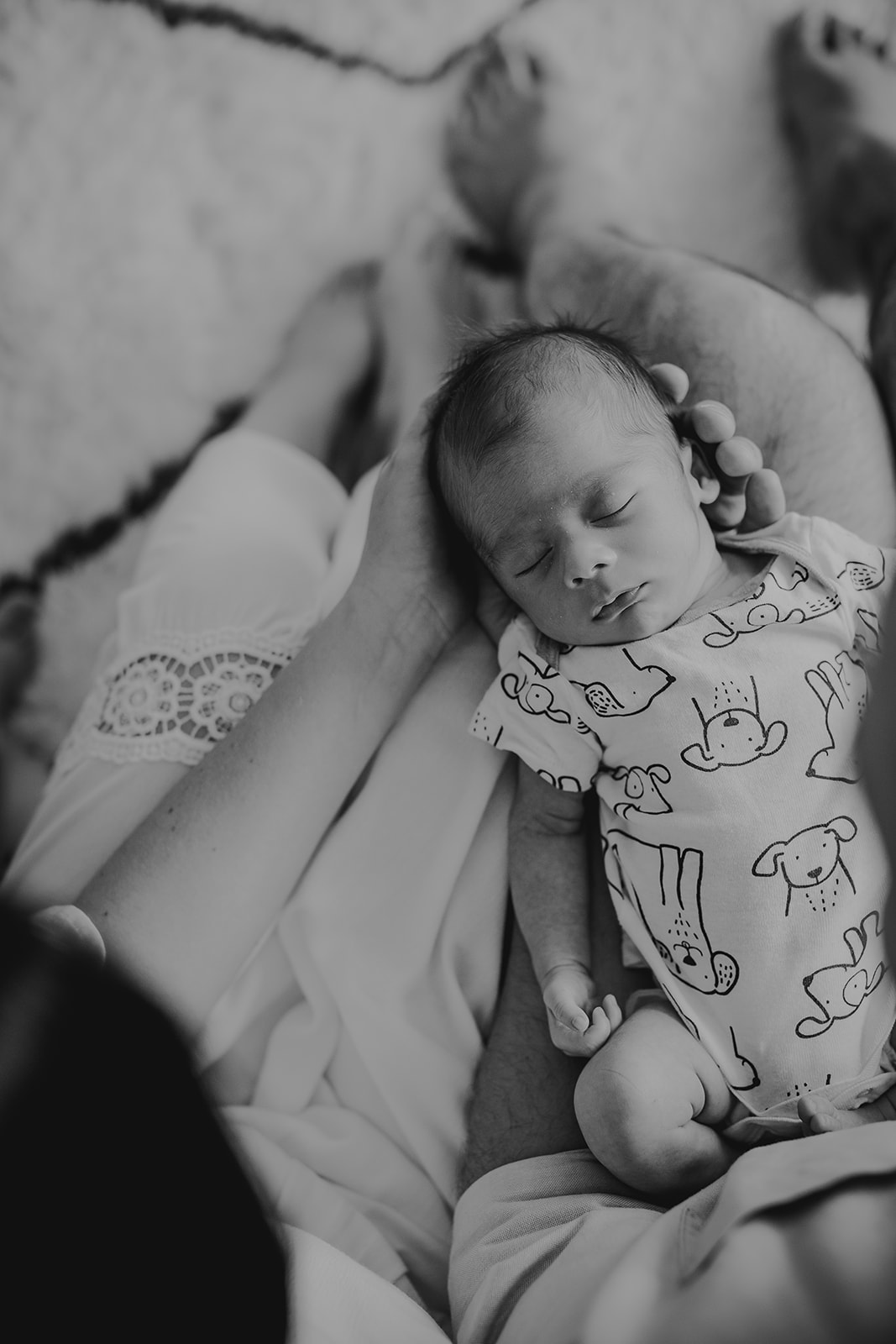 a black and white photograph of a newborn baby by a Kimberley, BC Newborn Photographer 