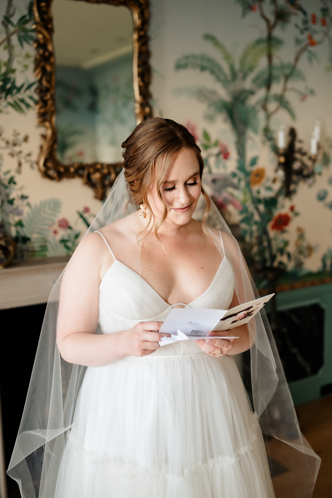 Bride reading love letter from groom at the Villa Terrace Decorative Art Museum. 