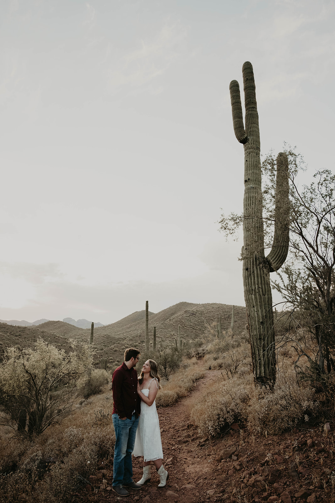 desert couple at river park for documentary engagement Arizona session, moody and romantic arizona sunset 
