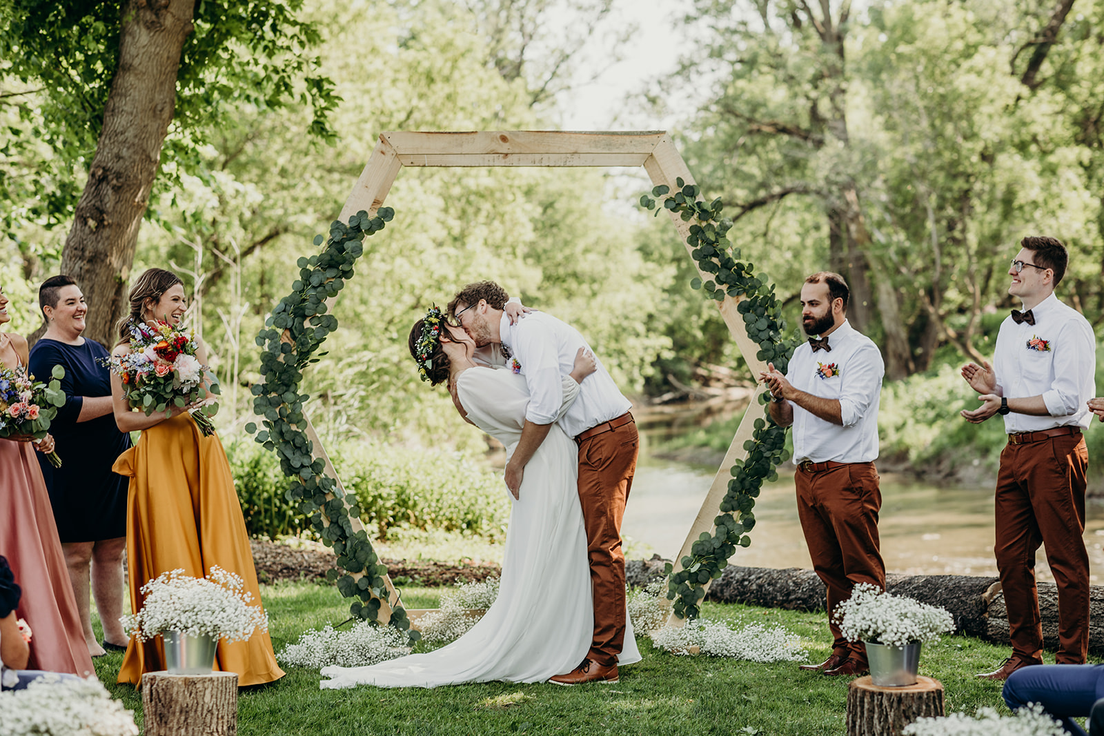 The river side ceremony in the perfect shaded spot for a backyard wedding