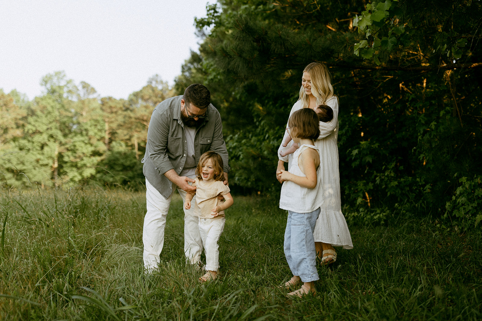 Family of five in a laid back field in georgia