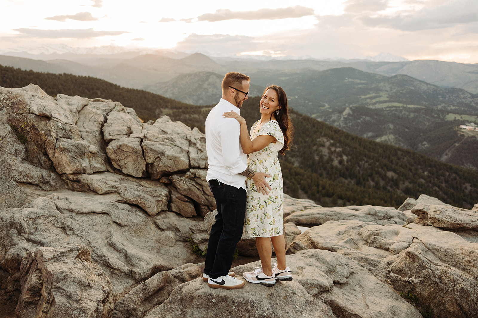 Man and woman standing on a mountain 