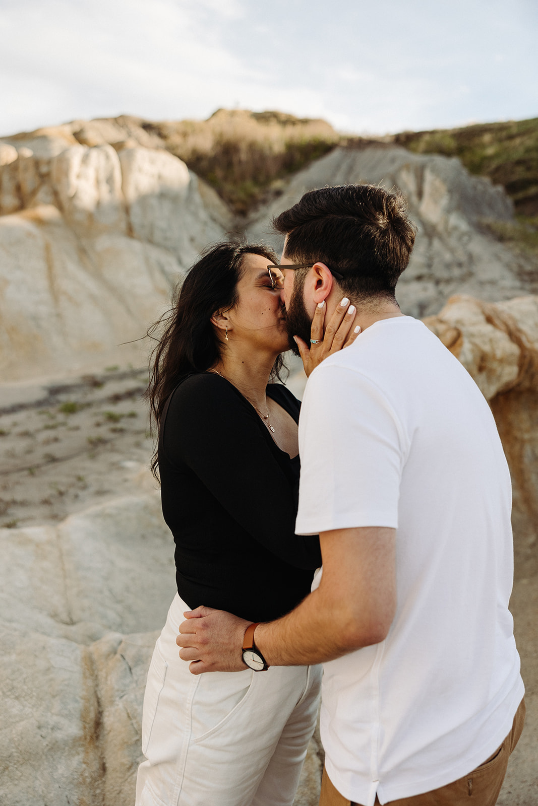 Man and woman kissing during their Mountain Engagement 