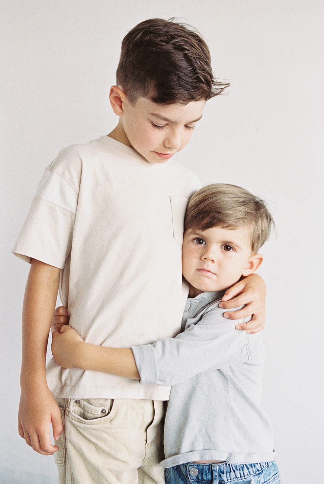Brothers pose in the natural light studio in Fort Payne, Alabama