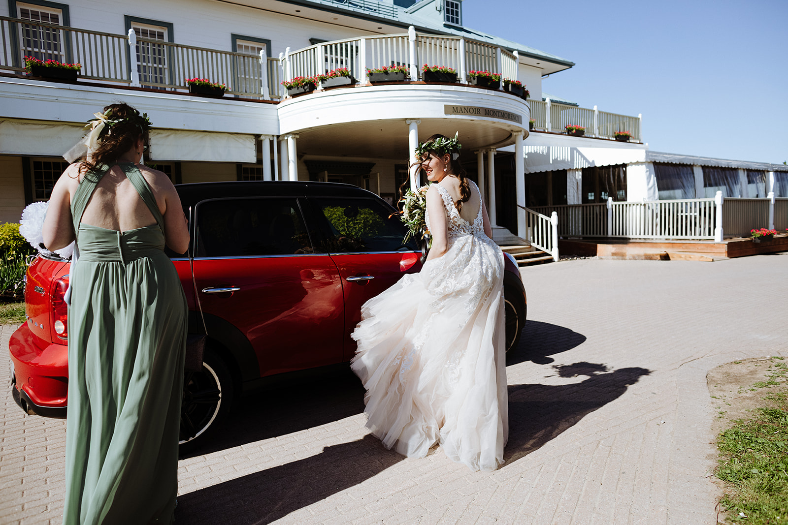 Bride arriving in her red car for her Manoir Montmorency Wedding