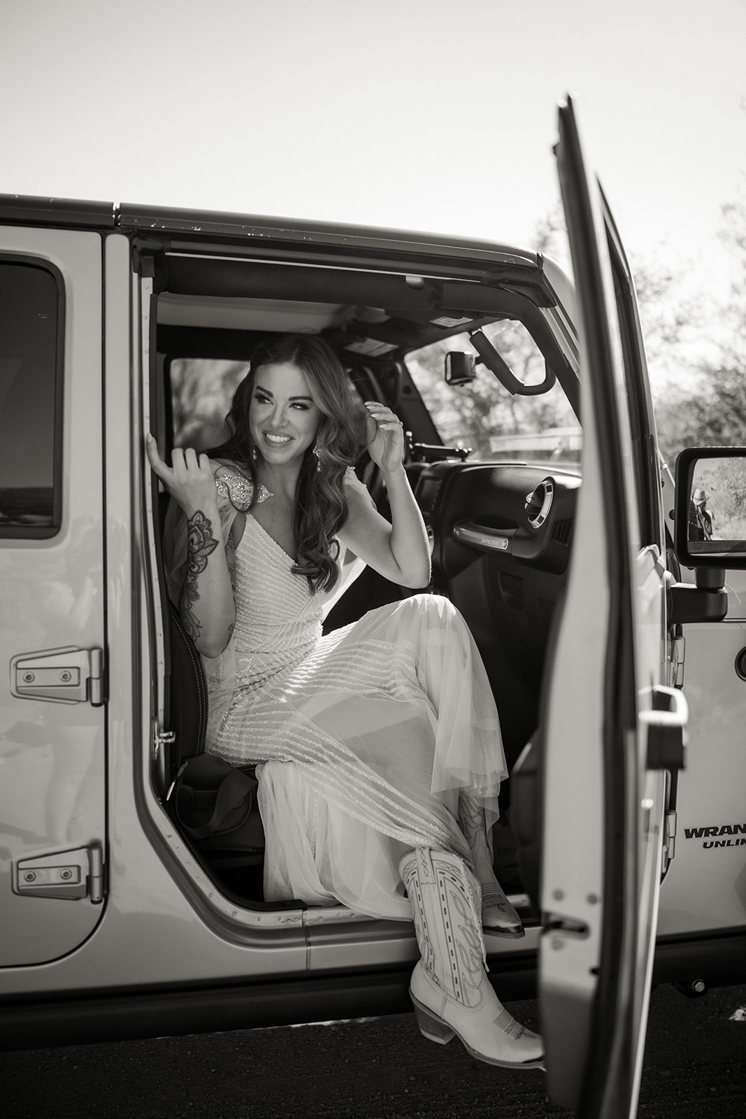 Bride emerging from Jeep