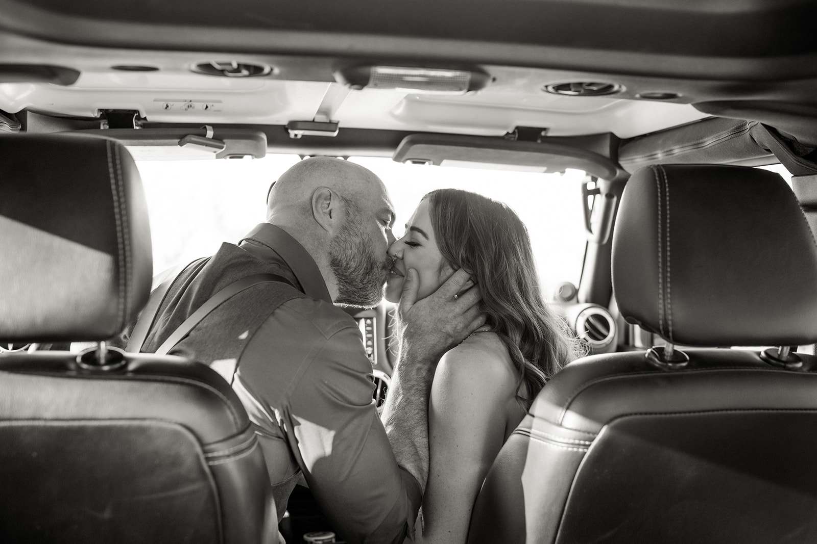 bride and groom kissing inside jeep at their gold canyon az elopement