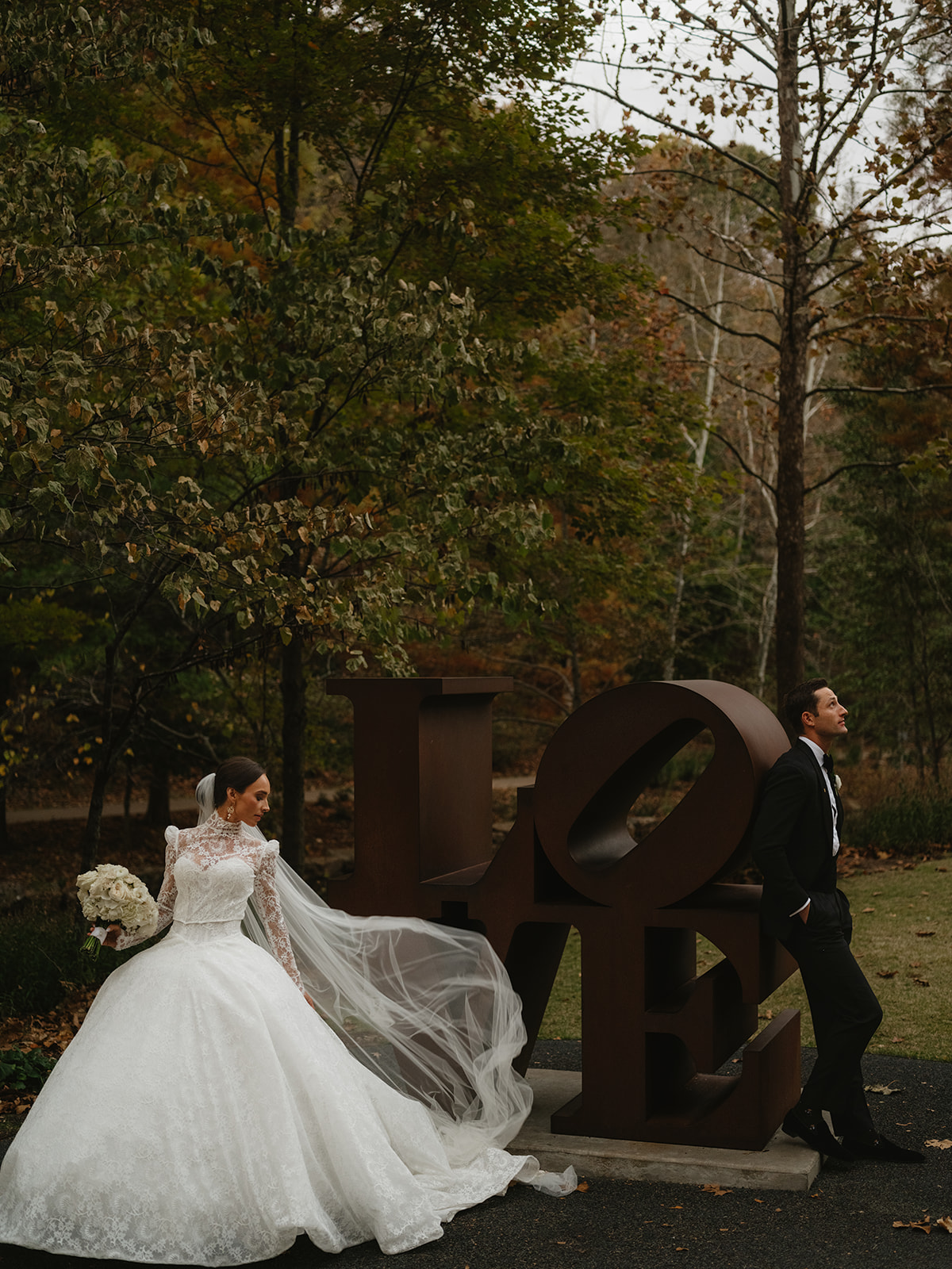 bride and groom love sculpture