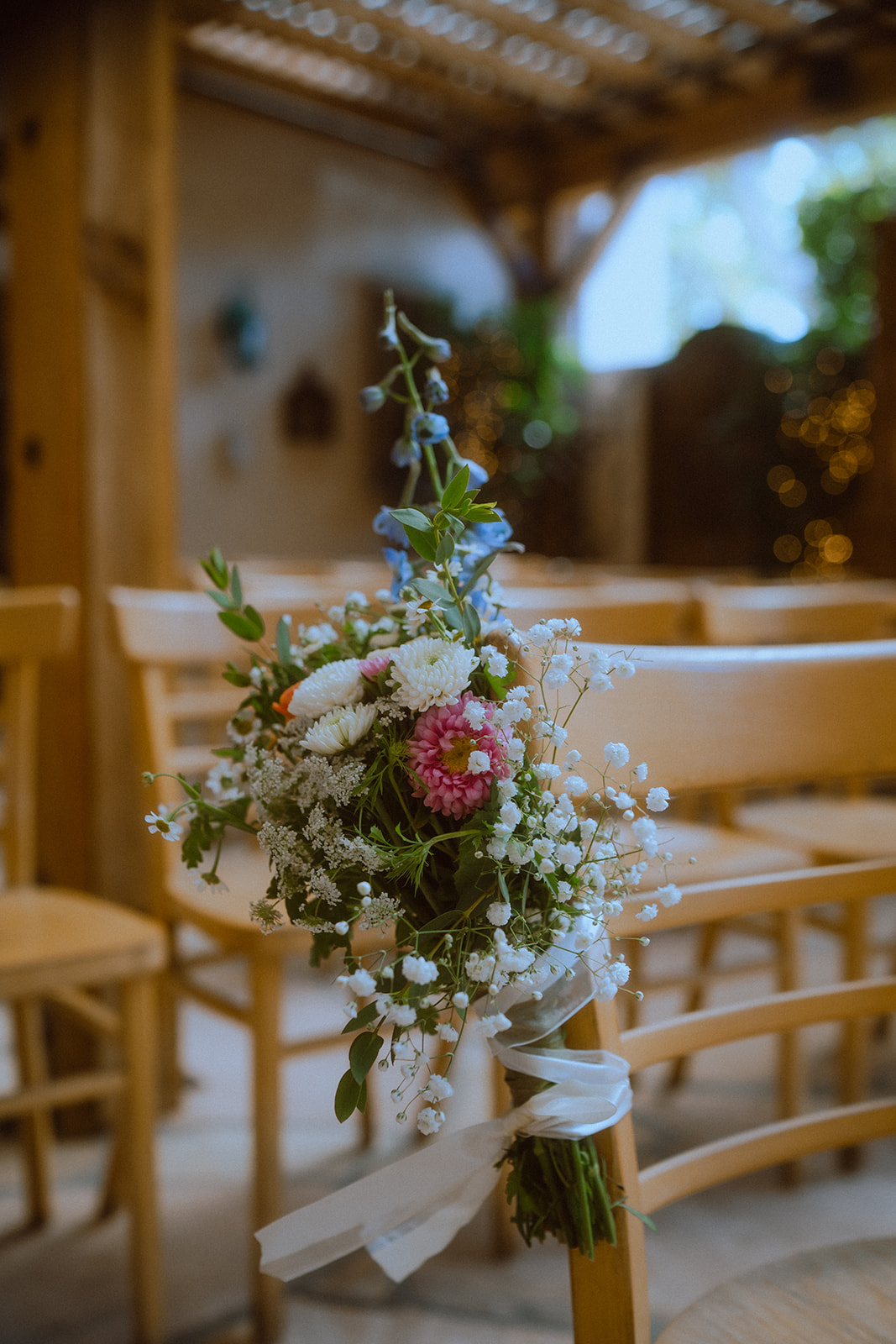ceremony flowers on chairs 
