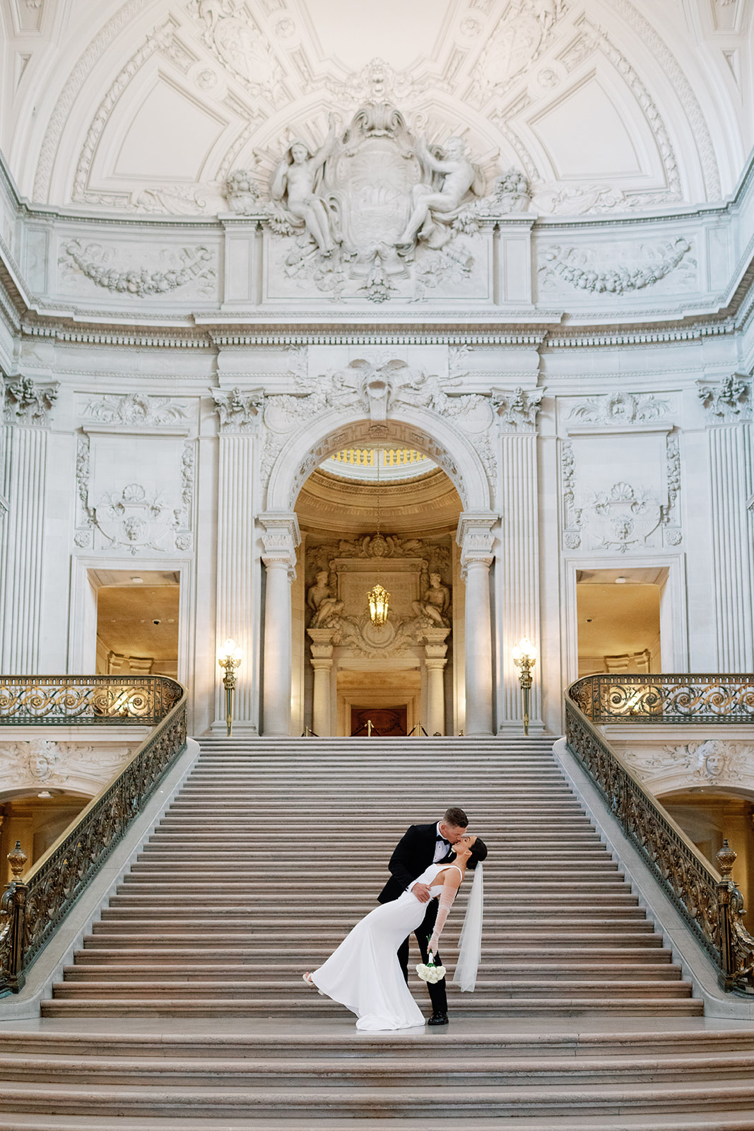 city hall staircase bride and groom