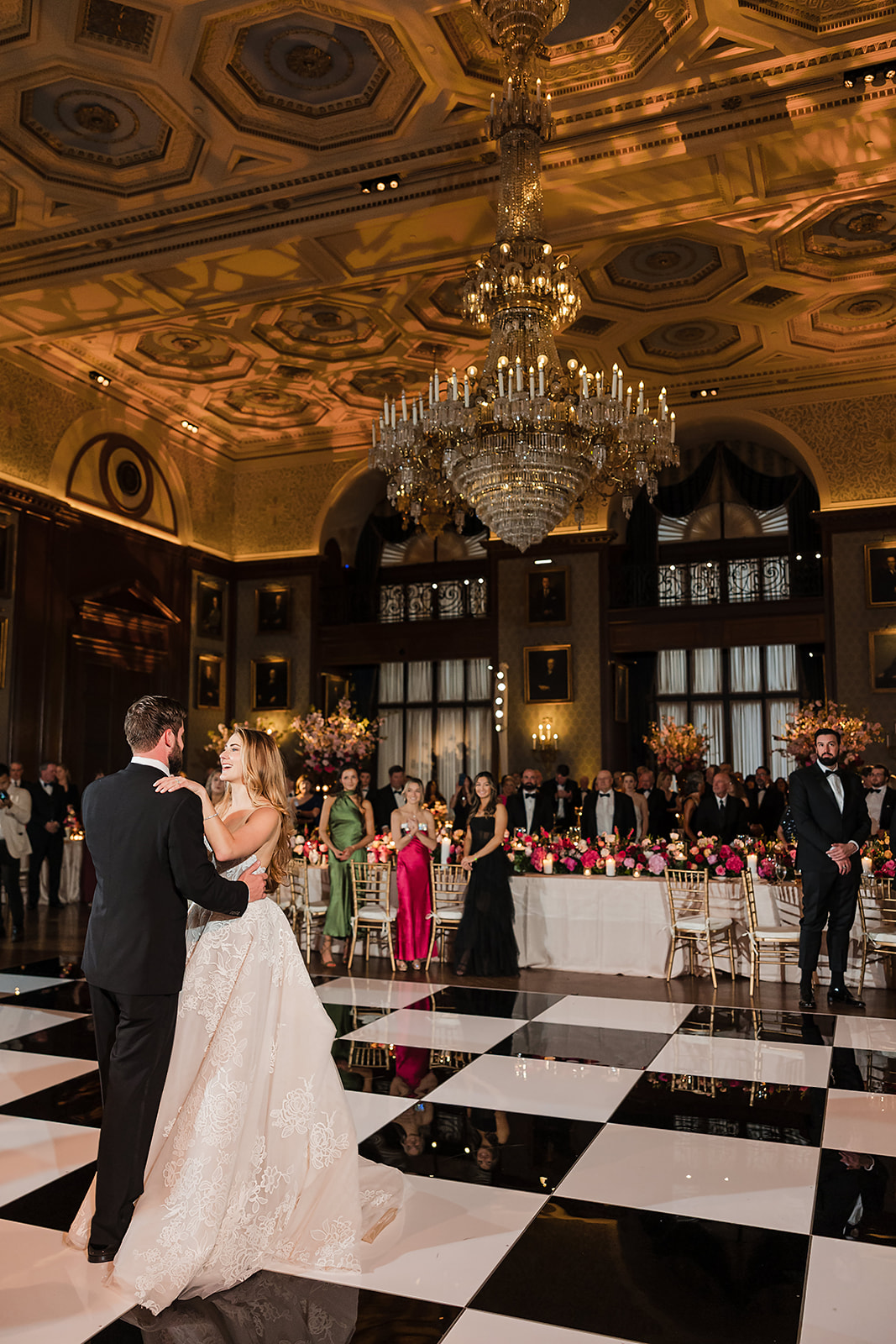 Bride and groom first dance on a checked floor at the Union League in Philly