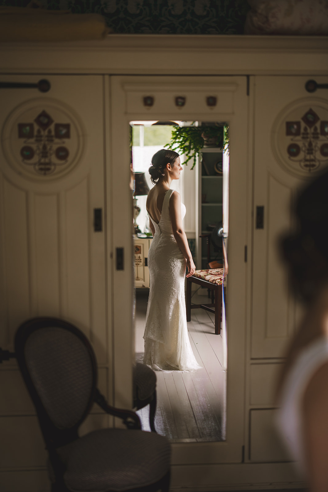 a bride reflected in a mirror in an historic old home in Ashfield, MA