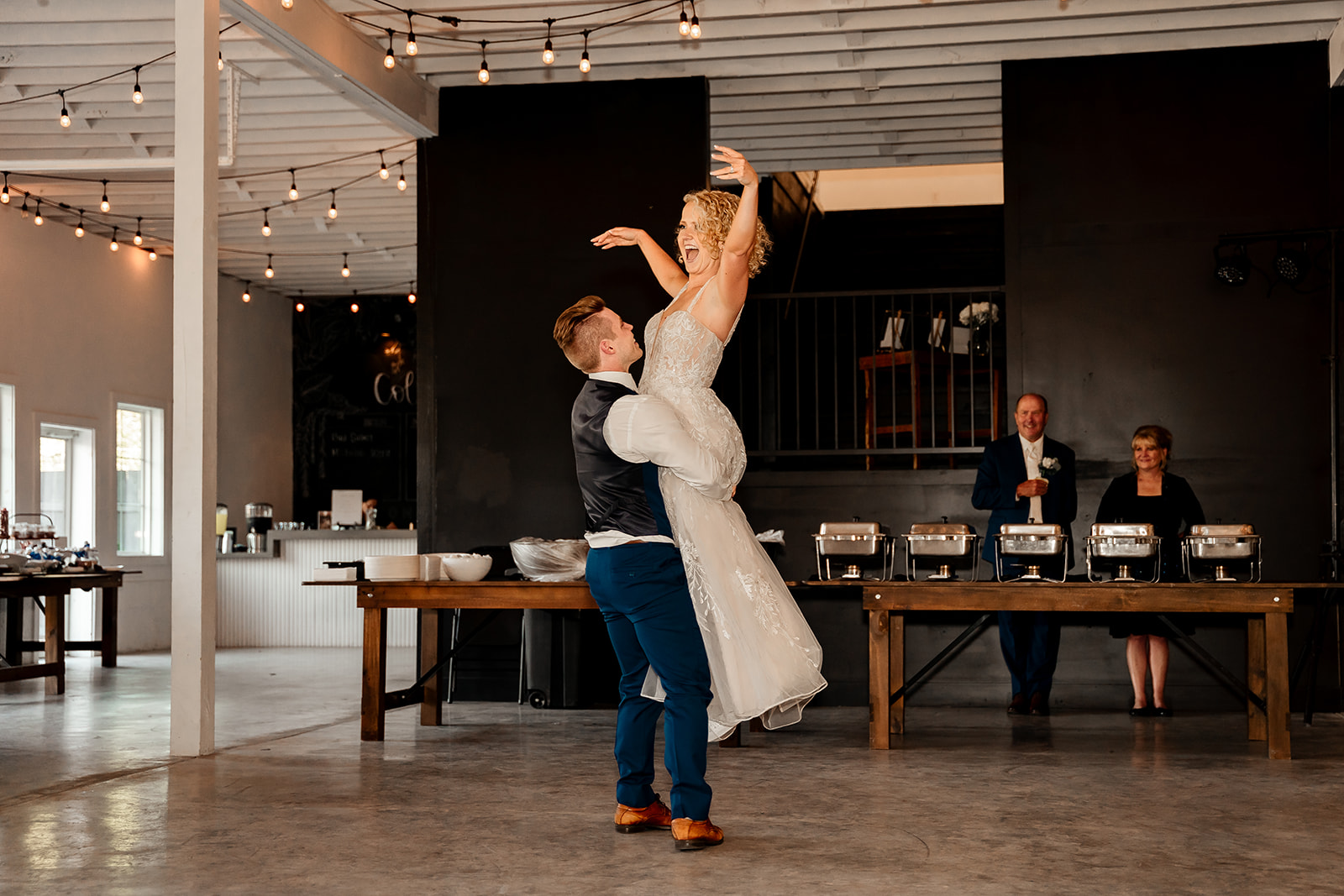 bride and groom first dance sons and daughters venue