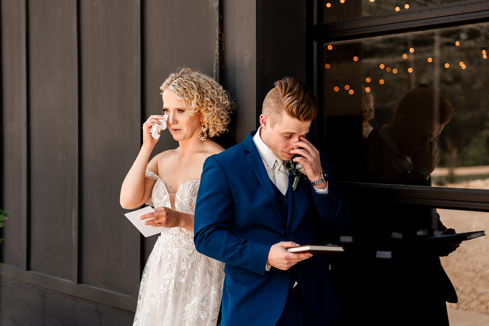 bride and groom reading lettings to each other at sons and daughters venue