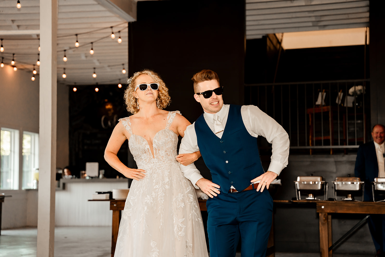 bride and groom surprise dance with sunglasses sons and daughters venue